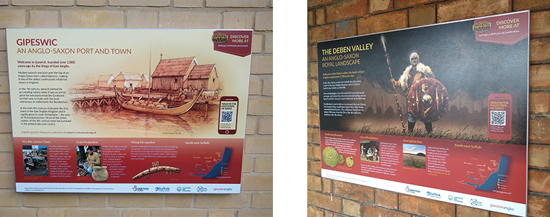 two information boards on brick walls